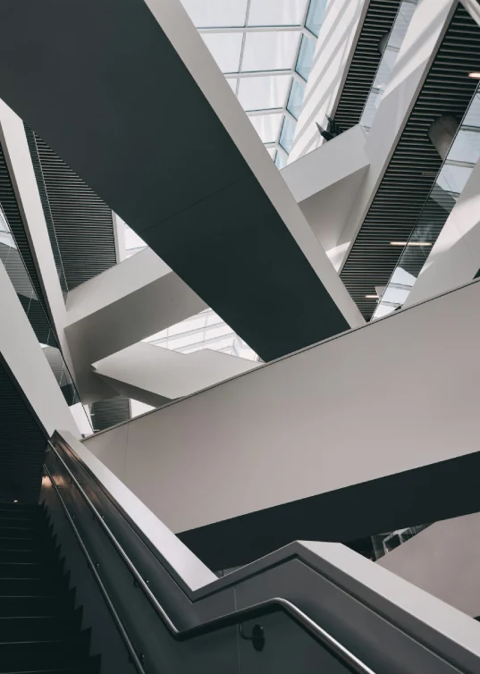 Modern architectural interior with geometric lines and staircases representing structured approach
