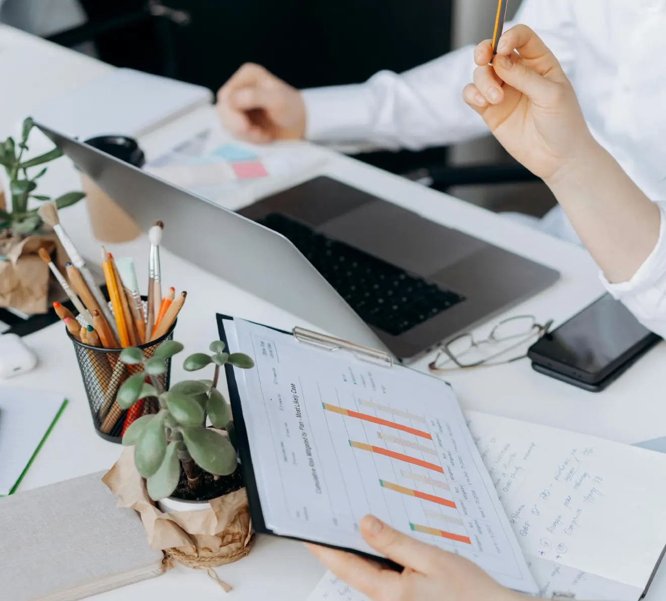 Professional analyzing business data charts on tablet during business process outsourcing workflow