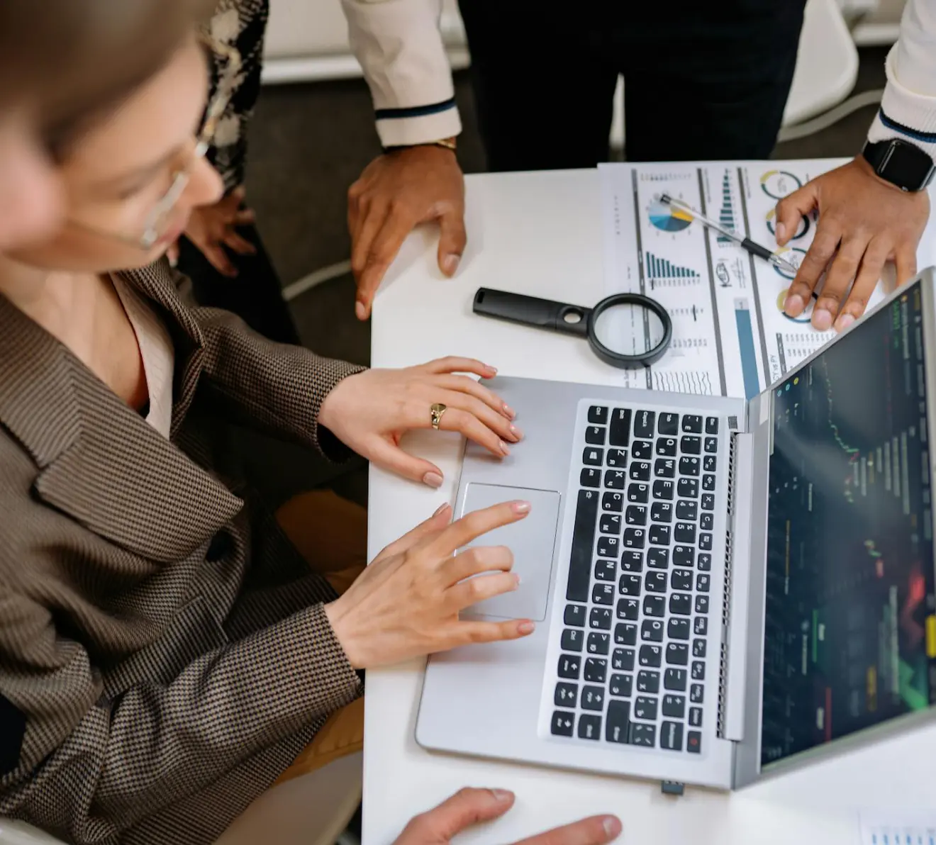 Professionals analyzing business data and dashboards for reporting services and performance insights