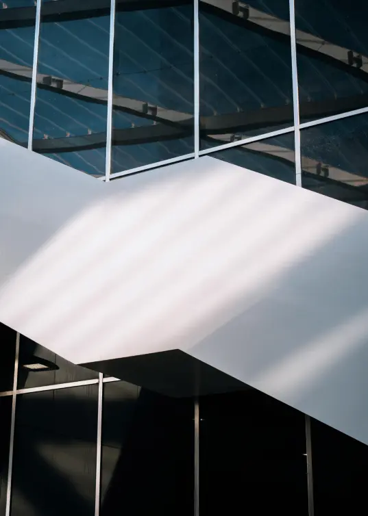 Modern architectural facade with clean geometric lines representing structured financial overview
