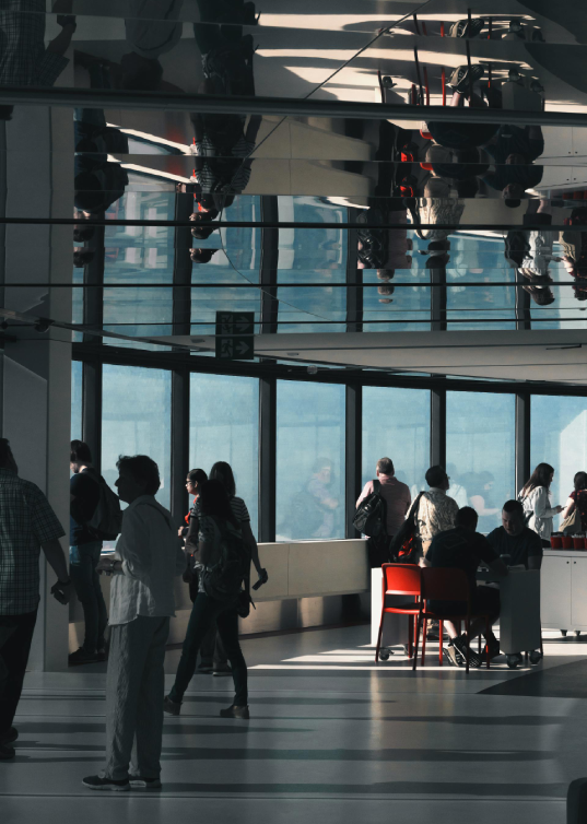 People interacting in a modern organizational space reflecting public sector governance and operations