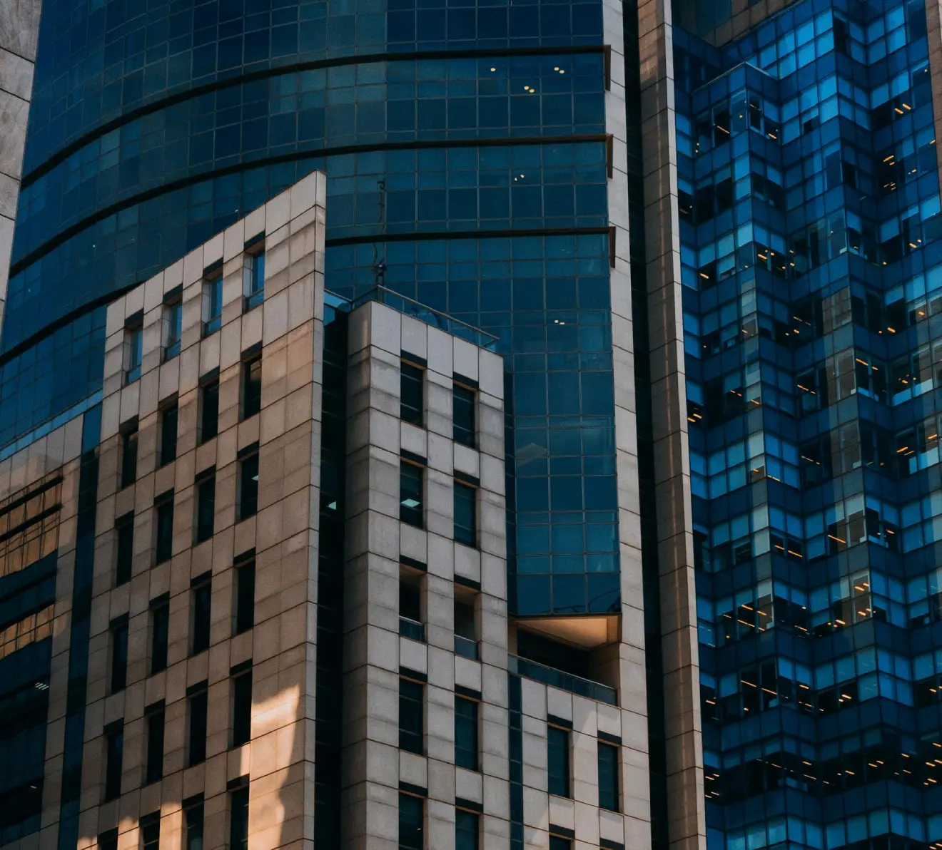 Modern urban architectural buildings with contrasting structures representing tax advisory and regulatory complexity