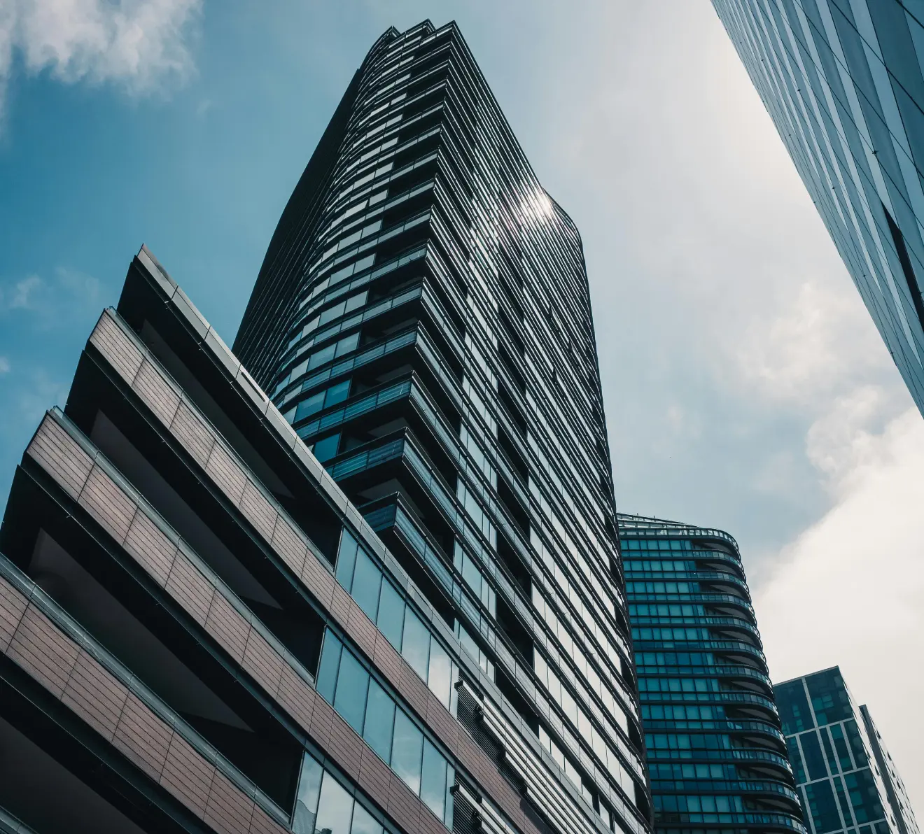Modern high-rise building with upward perspective representing strategic tax planning and future-oriented structure